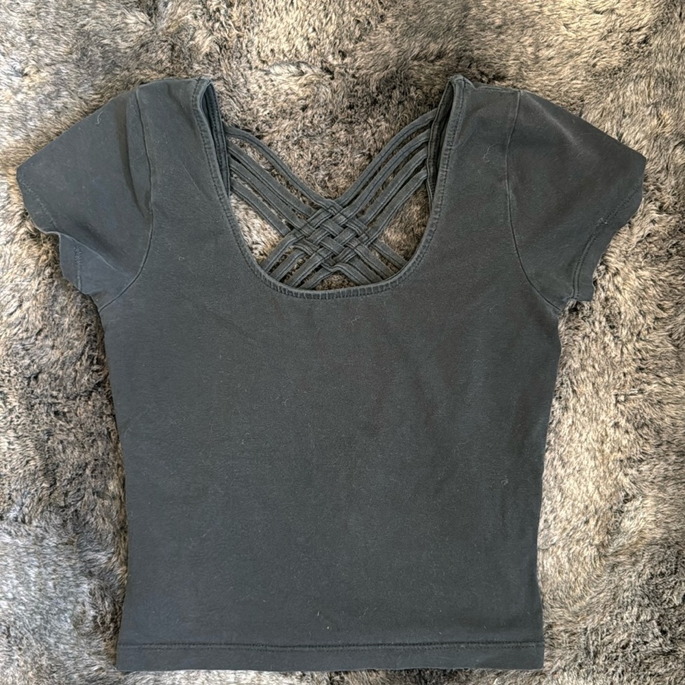 Unique criss-crossed detailed short sleeve crop top.